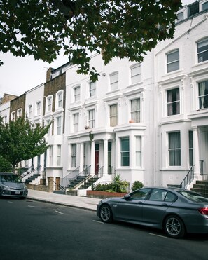Exterior of the building. The apartment is on the raised ground floor.