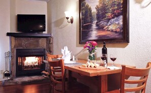 Woodburning fireplace and dining area