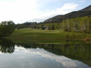 Less than 100 feet from the rental property.  Stocked fishing pond and 8th green 