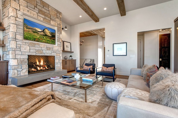 Jordanelle Estates 13201: Living Room: "Cozy space with a fireplace, TV, and stylish sofa set."