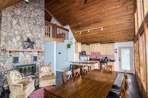 Main floor living/dining with wood burning fireplace 