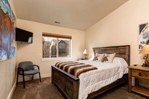 Bear Hollow Village 5639: Inviting bed, comfy chair, and a view through the window.