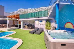 Outdoor area with heated pool and 6 persons jacuzzi