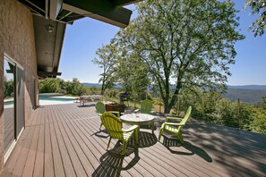 New deck with a fire pit and dining areas