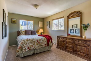 Master bedroom features queen bed and private bath.