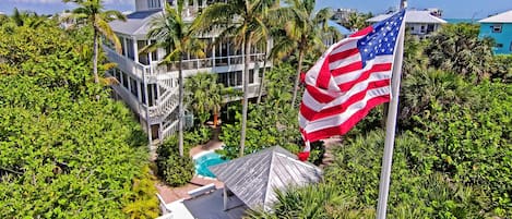 aerial view of house from beach side showing heated pool gazebo private walkway