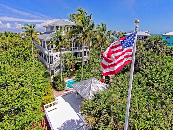aerial view of house from beach side showing heated pool gazebo private walkway