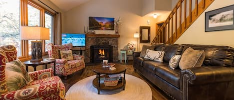 Living Room - filled with local art, wonderful views of river, gas fireplace