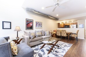 First floor living room with queen sleeper, dining area, kitchen and 1/2 bath
