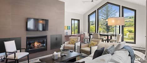 The living area is spacious but comfortable with high ceilings and amazing views of the golf course and surrounding mountains