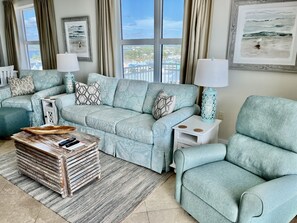 Living Area With Couch and Two Chairs