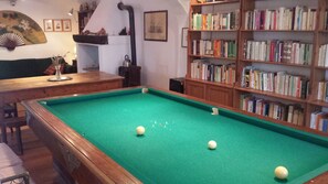 OLMI LIVING ROOM WITH BILLIARD DINING TABLE AND FIREPLACE