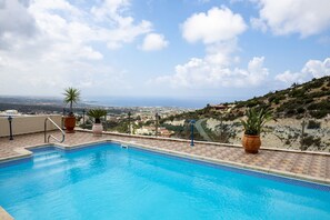 Pool and sea / mountain views beyond