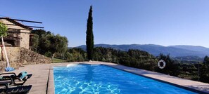 Views over a green valley to a nearby mountain range