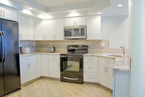 Completely updated kitchen with LED lighting to create any mood you desire.