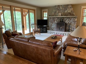 Cozy living room with wood burning fireplace