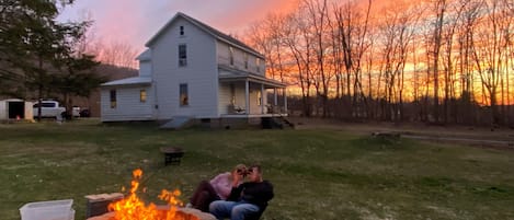 This is an outside view of the house at sunset at our fire pit. 