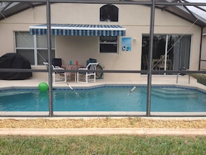 Screened patio, pool and barbeque
