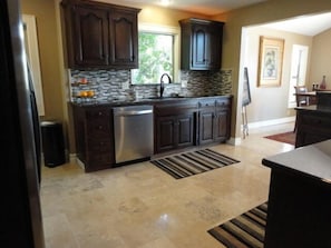 Kitchen sink, dishwasher and pass through to dinning room all on the top level.