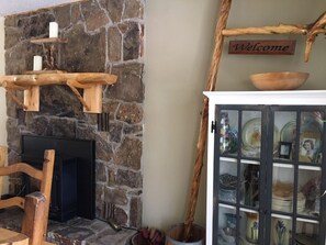 wood pellet stove and china closet in dining room