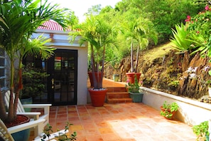 Main entry to the Villa via tiled decking from driveway