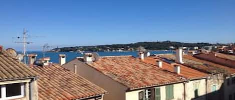 Sea view from terrace to Cap over rooftops - dining for 5/6 with 2 sun loungers