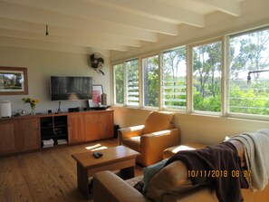 living area , tv, fox, and netflix access
