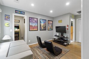 Game room with arcade and PS4 and Xbox One