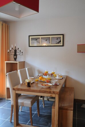 Loads of room at the dining table and the open concept is always nice for the cook.