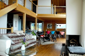 Main living room with open wood burning fire