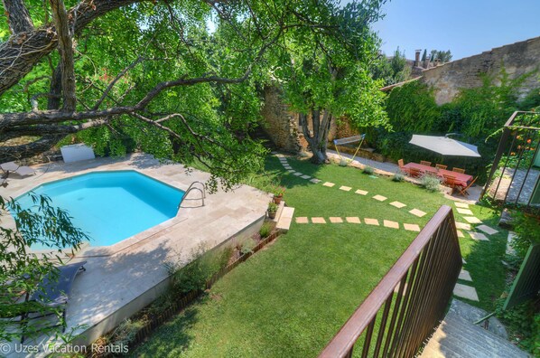 Secluded garden, pool and terrace overview seen from the main house balcony