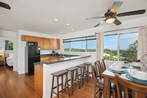 Kitchen and dining area with bar.