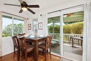 Dining area with sliders out to the lanai.