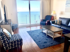 Livingroom with sliding glass doors to patio, grill, and amazing gulf views!