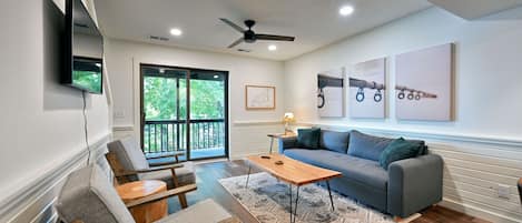 Living area with lake views and sofa sleeper.
