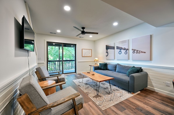 Living area with lake views and sofa sleeper.