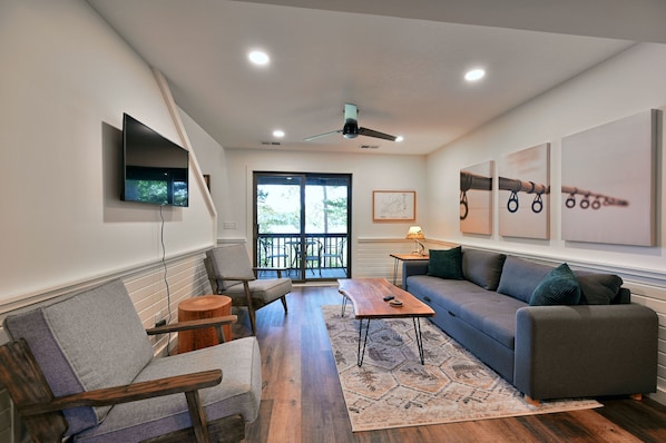 Living area with lake views and sofa sleeper.