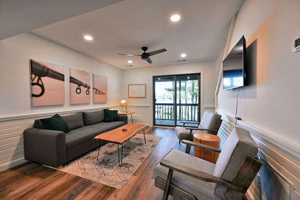 Living area with lake views and sofa sleeper.