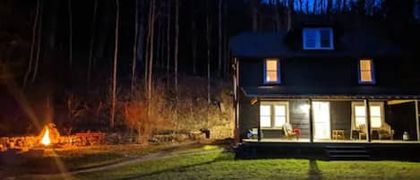 House and fire pit at night