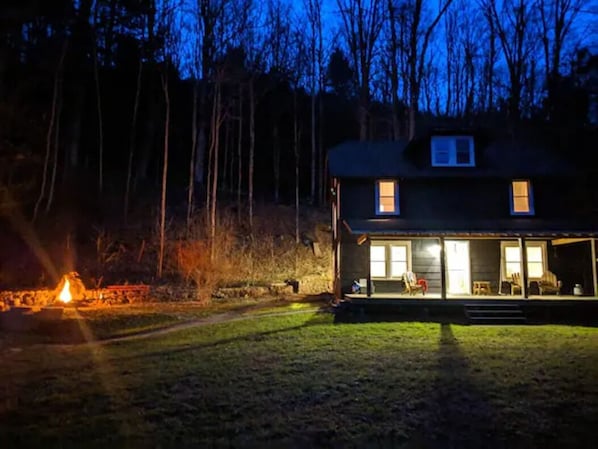 House and fire pit at night