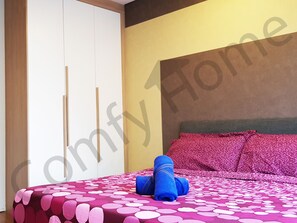Master bedroom with a comfortable queen size bed with pillow, comforter bedsheet