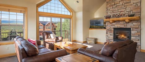 Main living area with gas fireplace, smart/Direct TV and plenty of seating