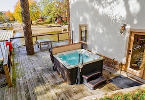 [Private Hot Tub] Relax and Indulge in the Private Hot Tub with Endless Views of Lake Hamilton and the Beautiful Nature Hot Springs, Arkansas has to Offer.