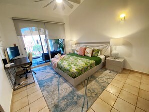 Master bedroom with direct access to patio and work area.