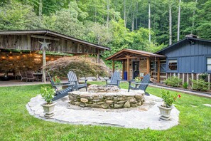 Large front yard with handmade firepit