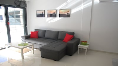 Modern apartment at 200 m from the sea with south facing terrace and swimming pool
