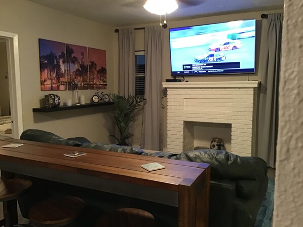 Living Room with 65" LG HD Smart TV, with full cable package