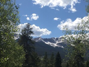 Enjoy panoramic mountain views of the Ten-Mile range from the large deck.