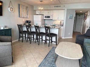 Fully stocked kitchen and comfortable bar chairs