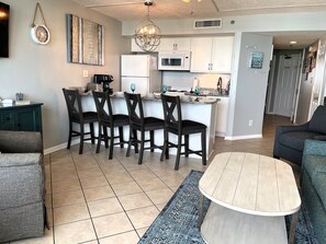 Fully stocked kitchen and comfortable bar chairs. Granite countertops.